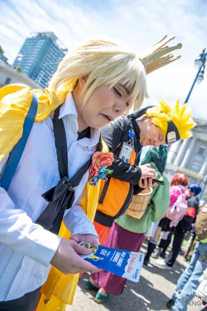 Photo by Christopher Pang / ChrisPang Productions. A cosplayer in a black and red outfit with a large red bow, at the NorCal Cherry Blossom Festival cosplay parade.