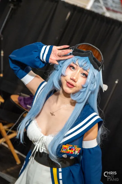 Photo by Christopher Pang / ChrisPang Productions. A cosplayer in a purple and white outfit at CarrierCon.
