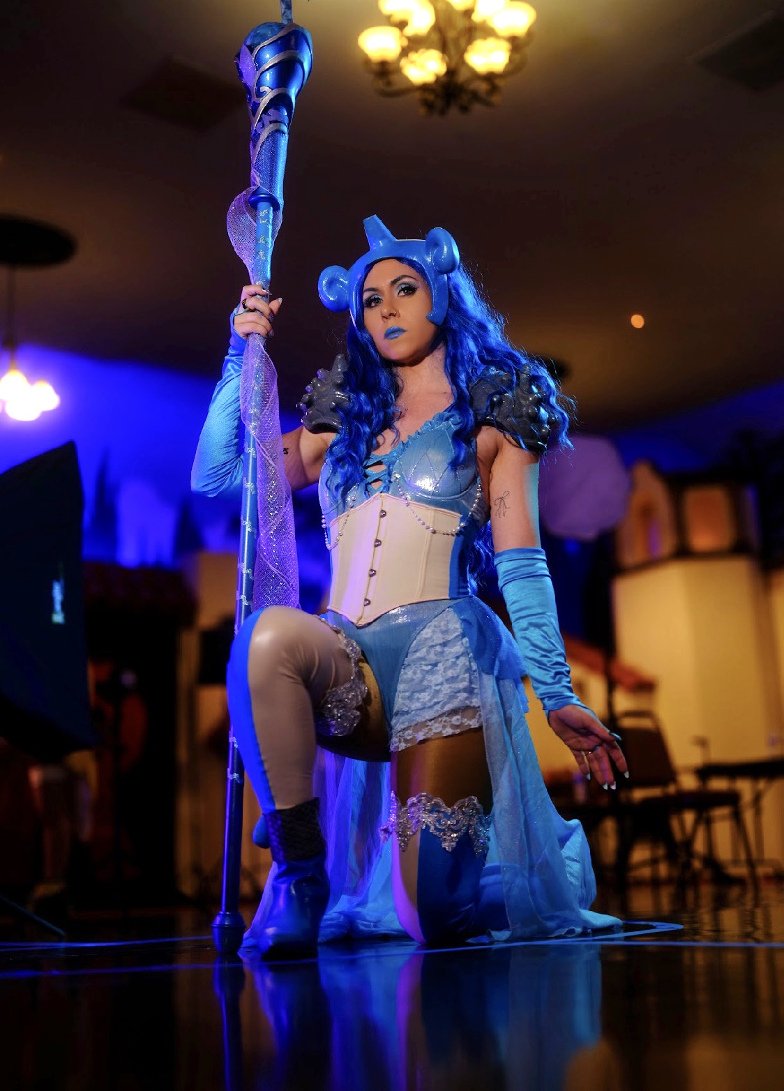 Lilith “Liliphae” Holmes as Lapras from Pokémon, in a blue shell costume and shell hat