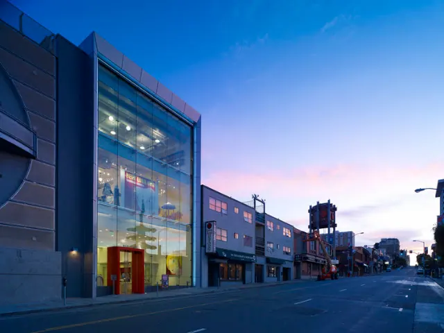 New People Cinema on Post Street at dusk, glass facade lit from inside