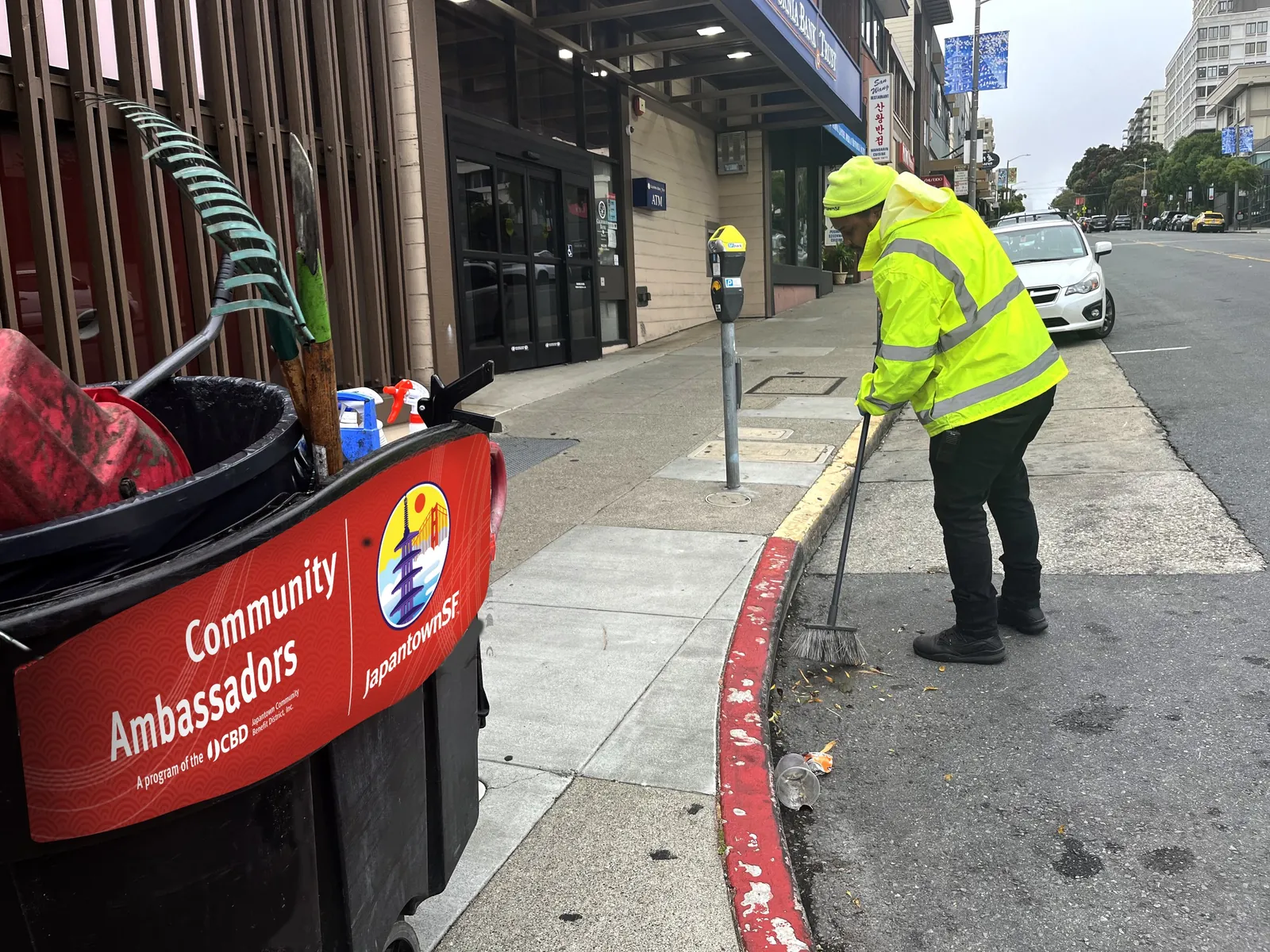 A JCBD Community Ambassador cleaning a Japantown sidewalk
