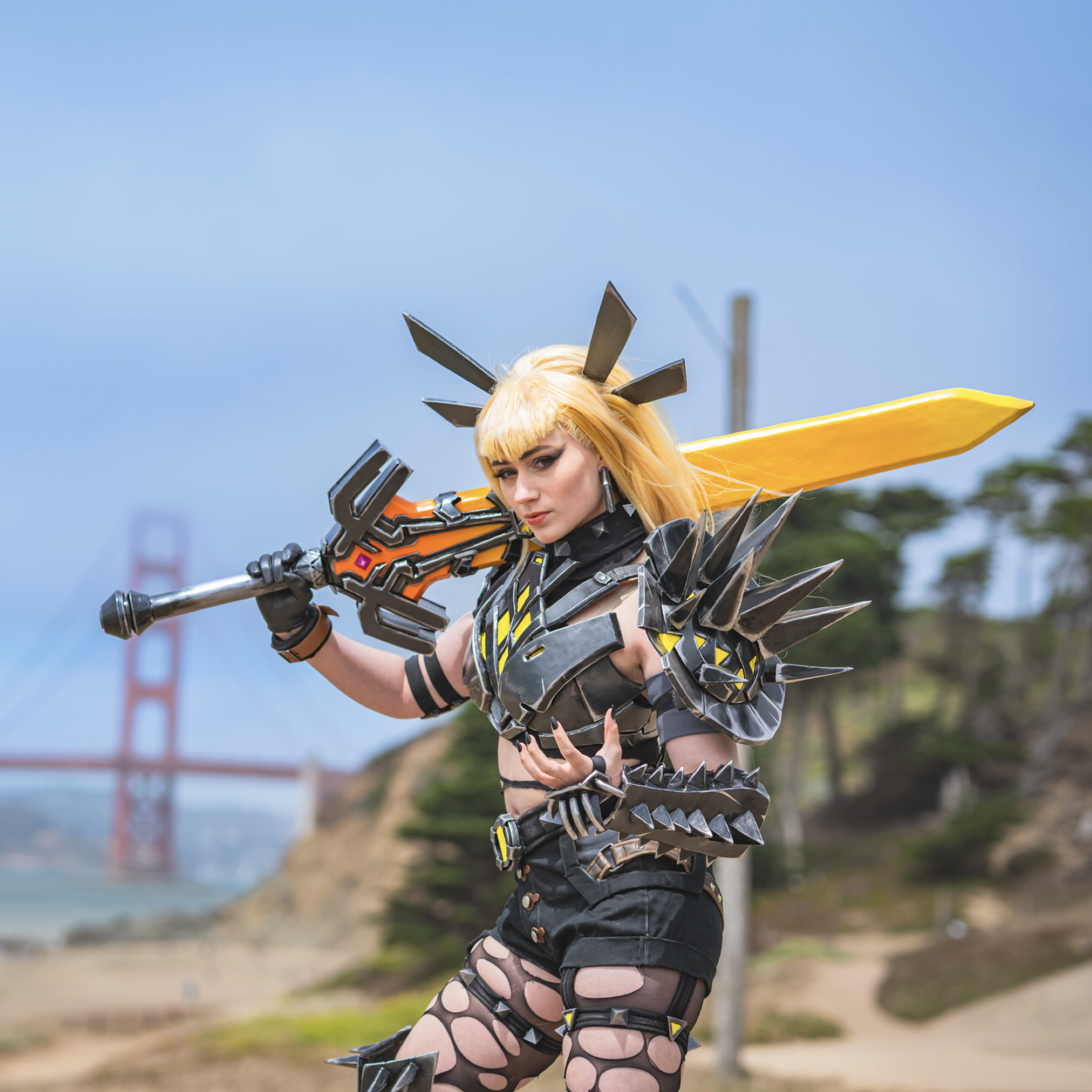 Craft example: Poppy Lop Cosplay as Magik, in a black and gold bodysuit with a horned headpiece, holding a large sword