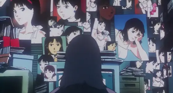 A wall covered in photographs of Mima